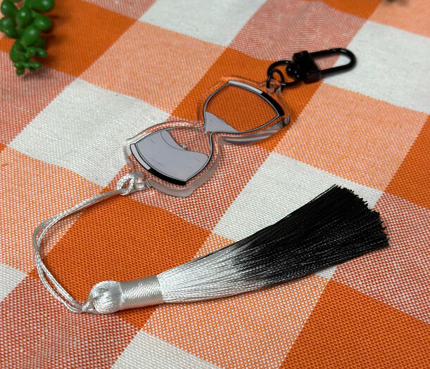 Unus annus Inspired Hourglass Tassel Keychain